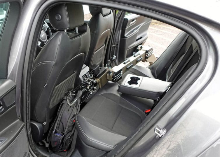 Vehicle interior with ICP NewTech UGV accessing a bag